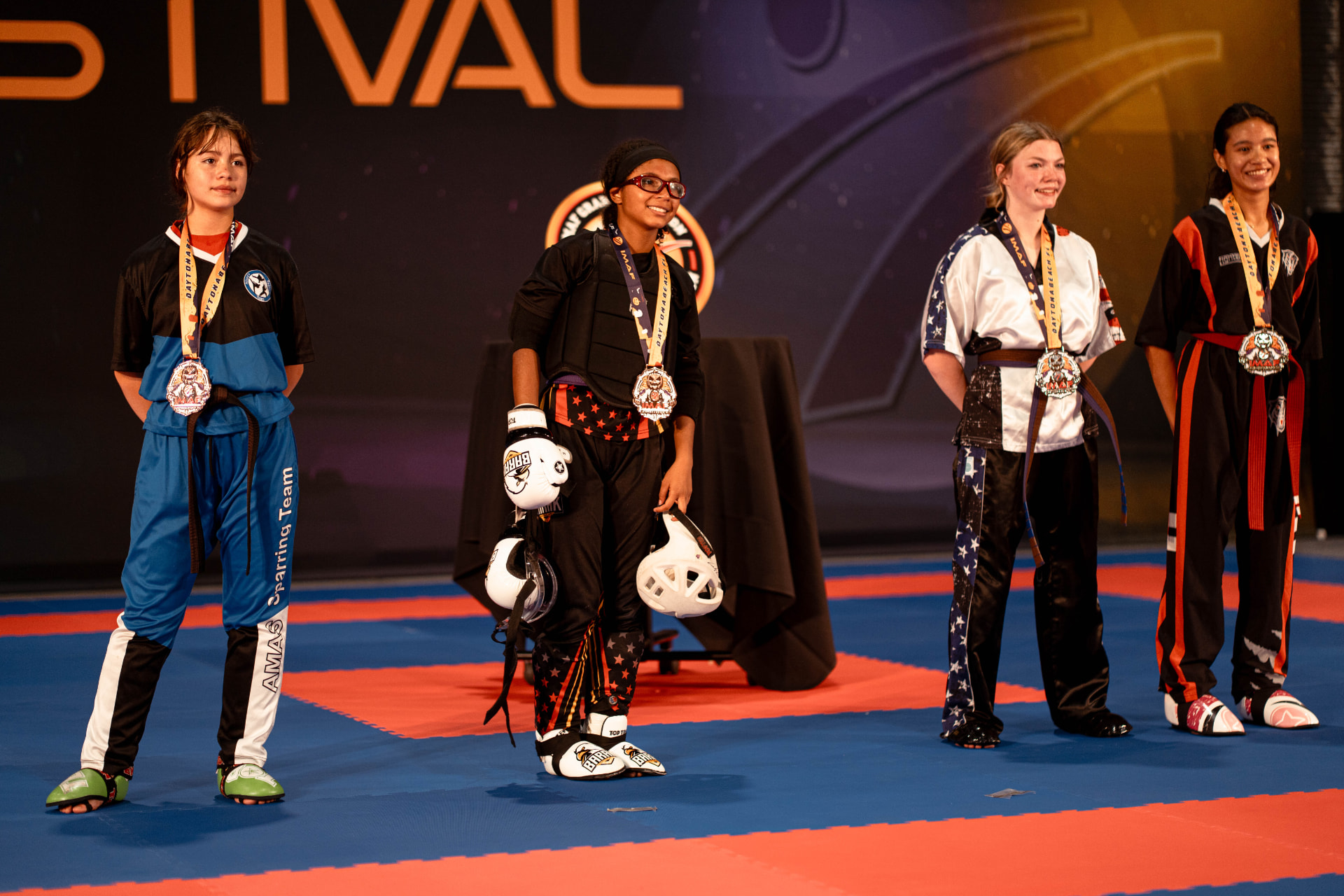 Martial arts competitors representing multiple disciplines at IMAF